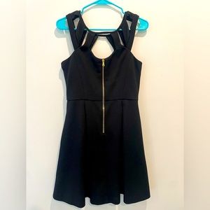 Size medium Betsey Johnson perfect black dress with cut out details on the chest